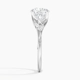 Camellia Milgrain Diamond Engagement Ring with a Round cut diamond in white gold — profile view