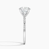 Delicate Versailles Diamond Engagement Ring with a Round cut diamond in white gold — profile view