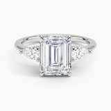 Adorned Opera Three Stone Diamond Engagement Ring with a Emerald cut diamond in white gold — top view