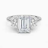 Petal Three Stone Diamond Engagement Ring with a Emerald cut diamond in white gold — top view