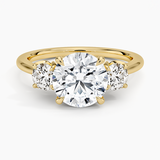 Petal Three Stone Diamond Engagement Ring with a Round cut diamond in yellow gold — top view