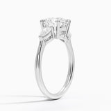 Opera Three Stone Diamond Engagement Ring with a Round cut diamond in white gold — side view
