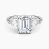 Opera Three Stone Diamond Engagement Ring with a Emerald cut diamond in white gold — top view