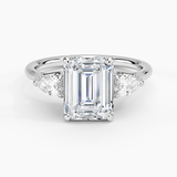Trellis Three Stone Pear Diamond Engagement Ring with a Emerald cut diamond in white gold — top view