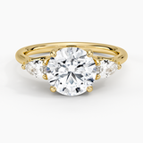 Trellis Three Stone Pear Diamond Engagement Ring with a Round cut diamond in yellow gold — top view