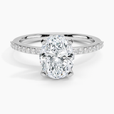 Delicate Shared Prong Diamond Engagement Ring with a Oval cut diamond in white gold — top view