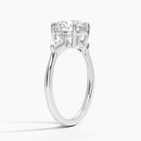 Cometa Three Stone Diamond Engagement Ring with a Round cut diamond in white gold — side view