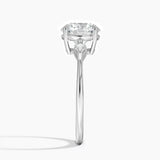 Cometa Three Stone Diamond Engagement Ring with a Round cut diamond in white gold — profile view