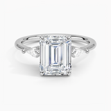 Cometa Three Stone Diamond Engagement Ring with a Emerald cut diamond in white gold — top view