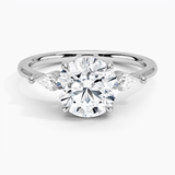 Cometa Three Stone Diamond Engagement Ring with a Round cut diamond in white gold — top view