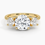 Luxe Selene Three Stone Diamond Engagement Ring with a Round cut diamond in yellow gold — top view