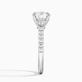 Amelie Three Stone Diamond Engagement Ring with a Round cut diamond in white gold — profile view