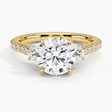 Amelie Three Stone Diamond Engagement Ring with a Round cut diamond in yellow gold — top view