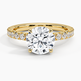 Olympia Half Coverage Diamond Engagement Ring with a Round cut diamond in yellow gold — top view