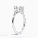 Adorned Petite Opera Three Stone Diamond Engagement Ring with a Round cut diamond in white gold — side view