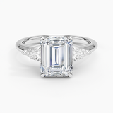 Fleur Three Stone Diamond Engagement Ring with a Emerald cut diamond in white gold — top view