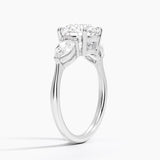 Luxe Opera Three Stone Diamond Engagement Ring with a Round cut diamond in white gold — side view