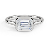 Luna East-West Bezel Solitaire Engagement Ring with a Emerald cut diamond in white gold