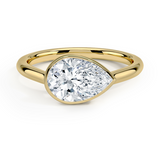 Luna East-West Bezel Solitaire Engagement Ring with a Pear cut diamond in yellow gold