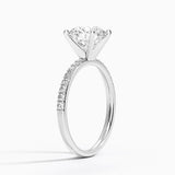 Petite Shared Prong Half Coverage Diamond Engagement Ring with a Round cut diamond in white gold — side view