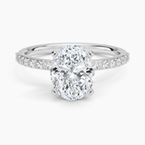 Petite Shared Prong Half Coverage Diamond Engagement Ring with a Oval cut diamond in white gold — top view