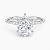Petite Shared Prong Half Coverage Diamond Engagement Ring with a Pear cut diamond in white gold — top view
