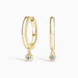 Diamond Drop Huggie Earrings in yellow gold — top view