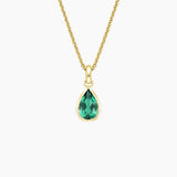 Teardrop Lab Emerald Pendant in yellow gold — top view