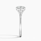 Tapered Baguette Three Stone Diamond Engagement Ring with a Round cut diamond in white gold — profile view