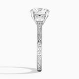 Antique Scroll Three Stone Trellis Diamond Engagement Ring with a Round cut diamond in white gold — profile view